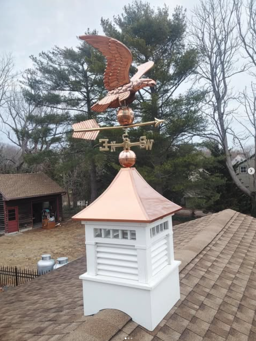 Decorative rooftop cupola with copper eagle weathervane